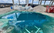 В Новомосковске за лесополосой нашли свалку с химикатами